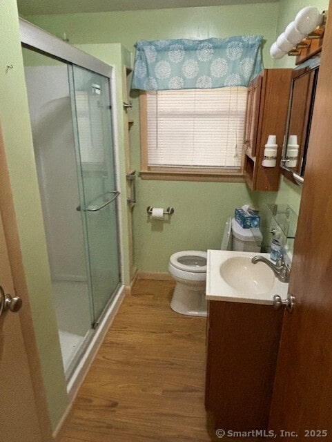 78 Pleasant View Rd, Thomaston, CT 06787 - bathroom featuring wood finished floors, a stall shower, vanity, toilet, and baseboards