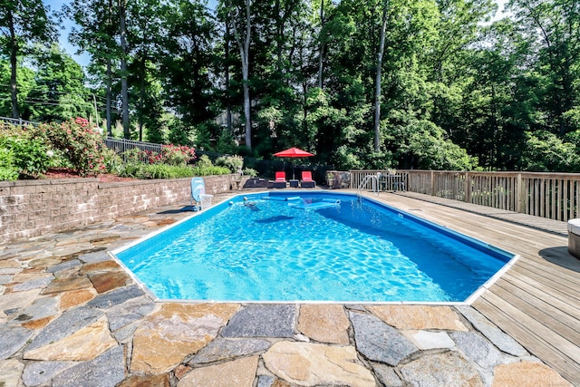 7 Broadview Rd, Brookfield, CT 06804 - view of swimming pool featuring a deck, a fenced backyard, and view of scattered trees