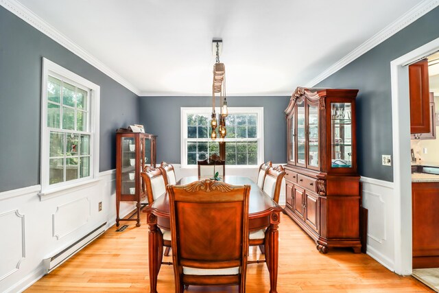 7 Broadview Rd, Brookfield, CT 06804 - dining area with baseboard heating, healthy amount of natural light, light wood-style floors, crown molding, and a wainscoted wall