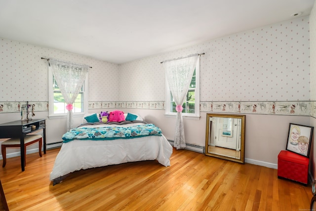 7 Broadview Rd, Brookfield, CT 06804 - bedroom featuring wallpapered walls, wainscoting, light wood-style floors, a baseboard heating unit, and a baseboard radiator
