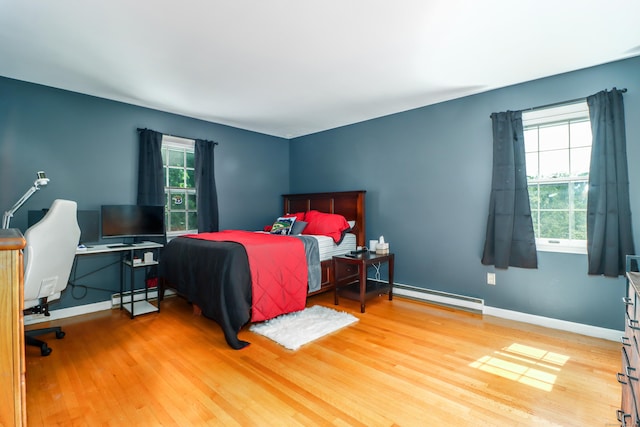 7 Broadview Rd, Brookfield, CT 06804 - bedroom featuring wood finished floors, multiple windows, a baseboard heating unit, and a baseboard radiator