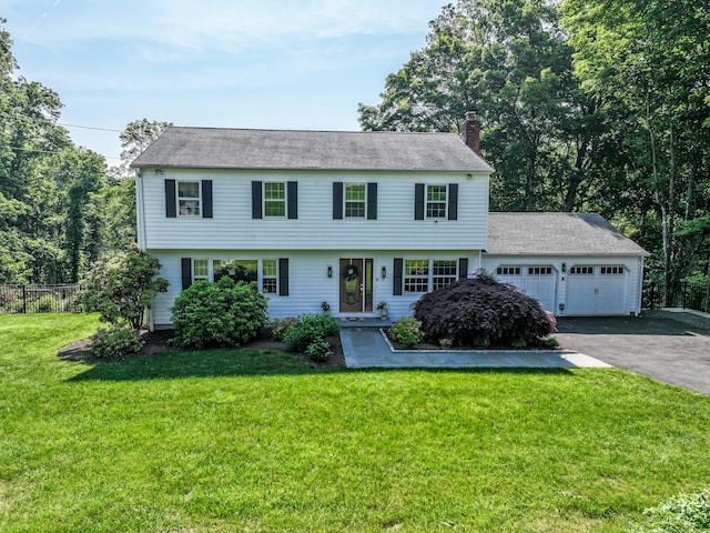 7 Broadview Rd, Brookfield, CT 06804 - colonial-style house featuring a chimney, an attached garage, driveway, and roof with shingles