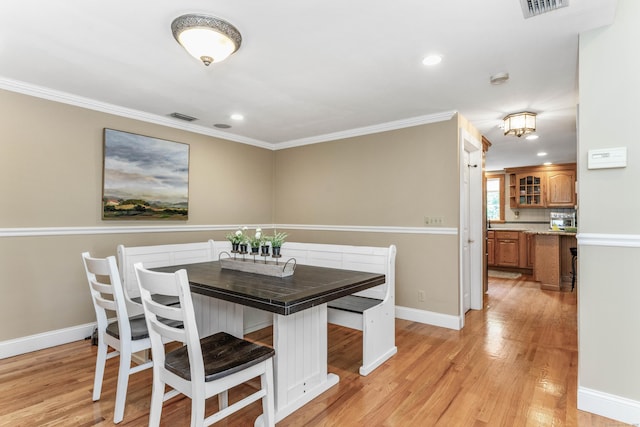 22 Lake Shore Dr, Middlefield, CT 06455 - dining area featuring light wood-style flooring, crown molding, baseboards, and recessed lighting