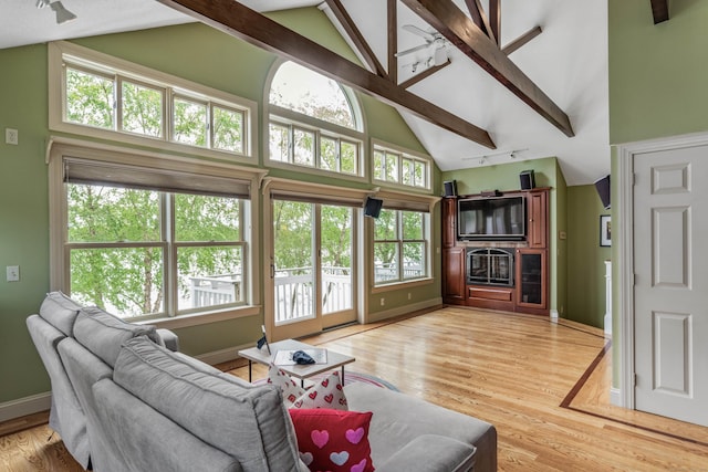 22 Lake Shore Dr, Middlefield, CT 06455 - living area featuring high vaulted ceiling, light wood-type flooring, beam ceiling, and baseboards