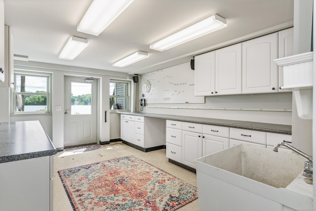 22 Lake Shore Dr, Middlefield, CT 06455 - kitchen with white cabinetry and a sink
