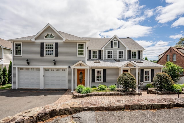 22 Lake Shore Dr, Middlefield, CT 06455 - view of front of house with asphalt driveway, a garage, and a shingled roof