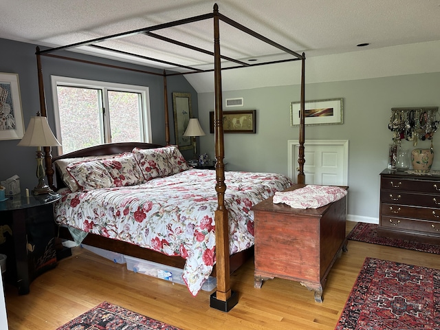 310 Weatherly Trl, Guilford, CT 06437 - bedroom with wood finished floors and a textured ceiling