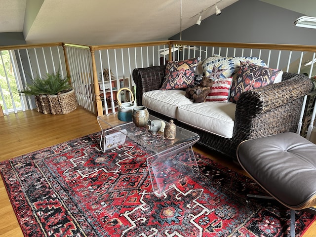 310 Weatherly Trl, Guilford, CT 06437 - living area with wood finished floors, vaulted ceiling, and rail lighting