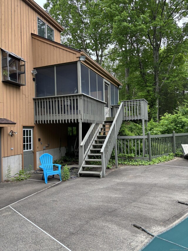 310 Weatherly Trl, Guilford, CT 06437 - view of patio / terrace featuring a sunroom and stairway