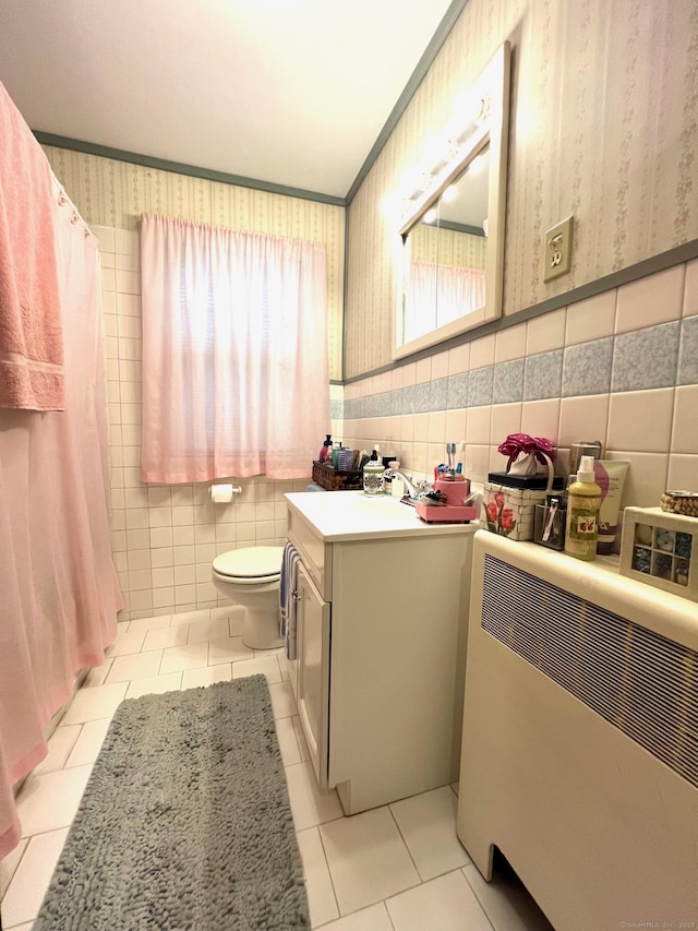 13 Oak St, Wolcott, CT 06716 - bathroom with tile walls, tile patterned flooring, vanity, and toilet