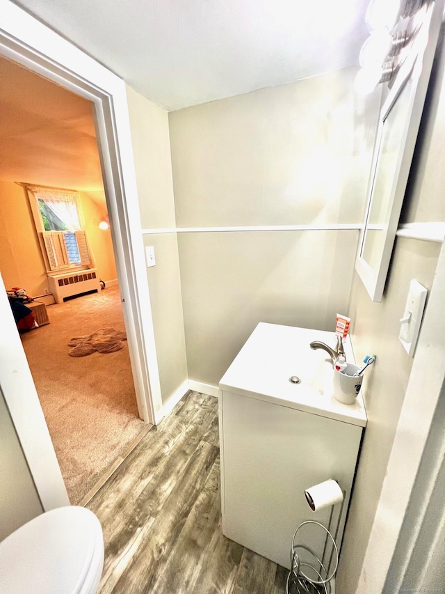 13 Oak St, Wolcott, CT 06716 - half bath featuring vanity, toilet, and wood finished floors