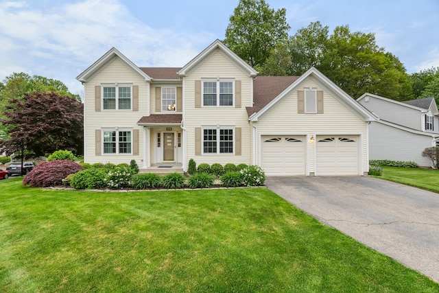 55 Oak Ridge Ln, Milford, CT 06461 - traditional-style home with asphalt driveway, a front lawn, roof with shingles, and a garage