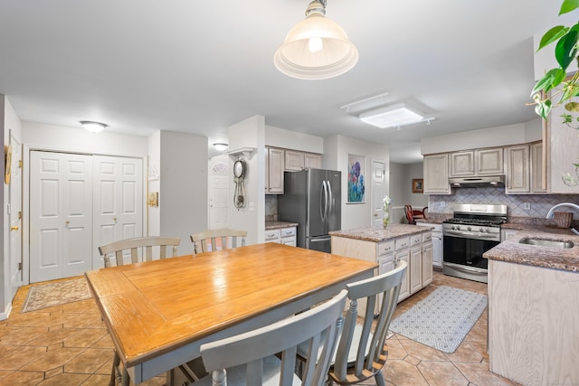 55 Oak Ridge Ln, Milford, CT 06461 - kitchen with appliances with stainless steel finishes, a sink, under cabinet range hood, a center island, and tasteful backsplash