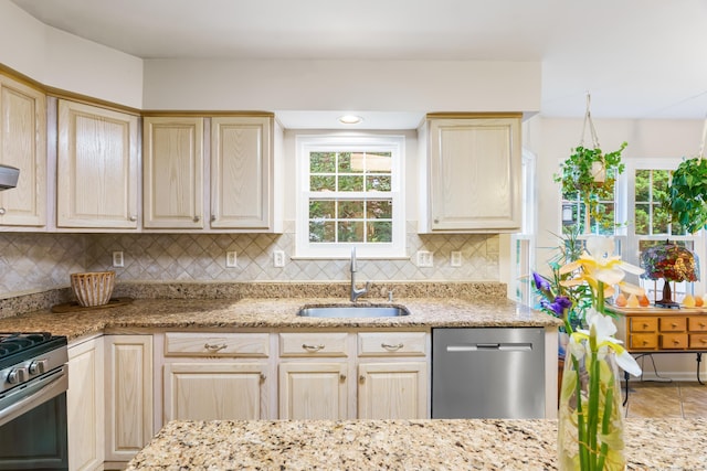 55 Oak Ridge Ln, Milford, CT 06461 - kitchen featuring a sink, stainless steel appliances, plenty of natural light, and tasteful backsplash