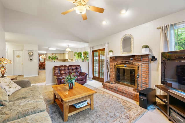 55 Oak Ridge Ln, Milford, CT 06461 - living area with a fireplace, ceiling fan, and lofted ceiling