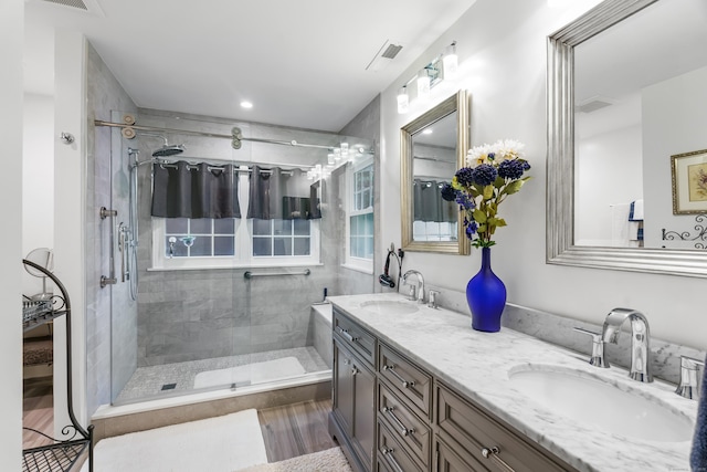 55 Oak Ridge Ln, Milford, CT 06461 - bathroom featuring double vanity and a tile shower