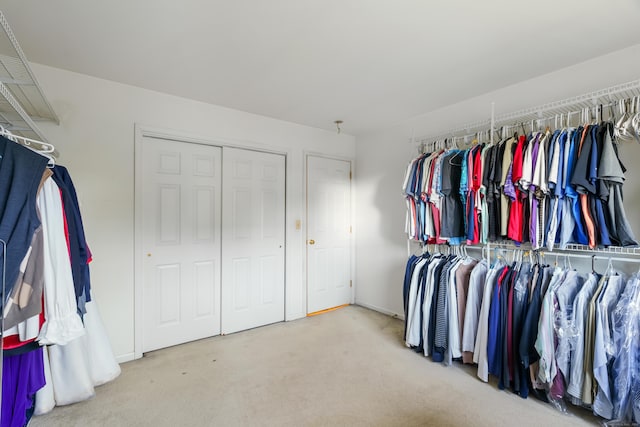 55 Oak Ridge Ln, Milford, CT 06461 - walk in closet featuring carpet