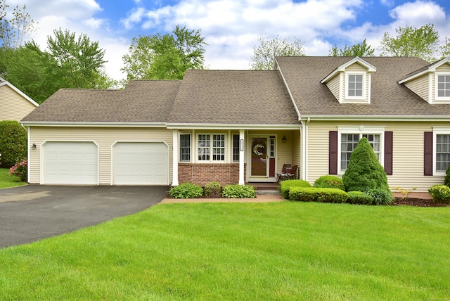 63 Hudson Ln Unit 63, Windsor, CT 06095 - cape cod-style house featuring driveway, a garage, a front lawn, roof with shingles, and brick siding