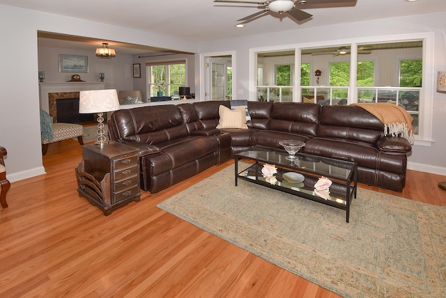 63 Hudson Ln Unit 63, Windsor, CT 06095 - living area featuring a ceiling fan, wood finished floors, baseboards, and a fireplace