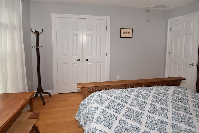 63 Hudson Ln Unit 63, Windsor, CT 06095 - bedroom featuring a closet, light wood-type flooring, and baseboards
