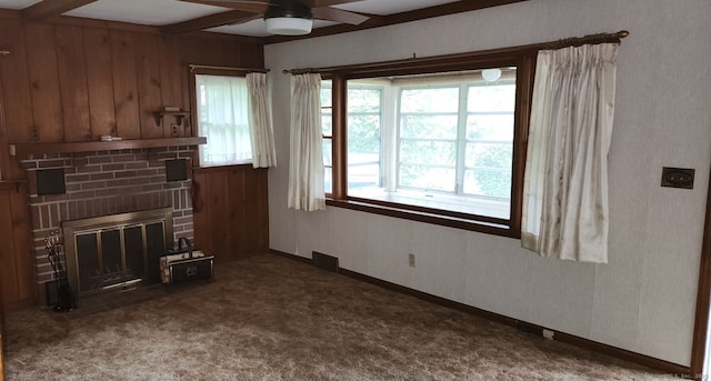 71 Sherry Ln, New Milford, CT 06776 - carpeted living area featuring ceiling fan, beam ceiling, a fireplace, and wooden walls