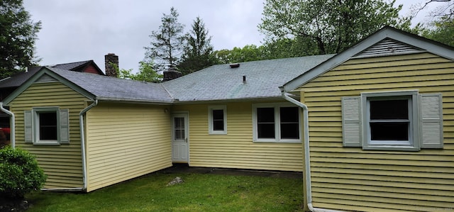 71 Sherry Ln, New Milford, CT 06776 - back of property featuring a chimney and a lawn