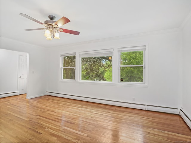 56 Great Neck Rd, Trumbull, CT 06611 - unfurnished room featuring baseboard heating, healthy amount of natural light, light wood finished floors, and crown molding