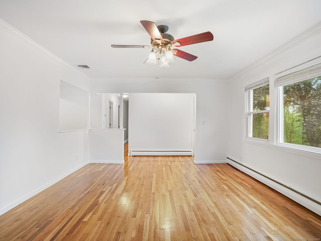 56 Great Neck Rd, Trumbull, CT 06611 - spare room with a baseboard heating unit, ornamental molding, light wood-type flooring, a ceiling fan, and baseboards