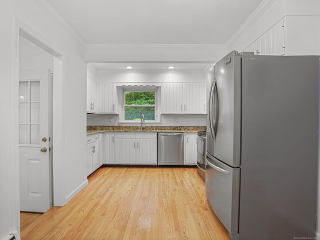 56 Great Neck Rd, Trumbull, CT 06611 - kitchen featuring stainless steel appliances, a sink, white cabinetry, stone counters, and light wood-type flooring