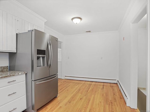 56 Great Neck Rd, Trumbull, CT 06611 - kitchen featuring stainless steel fridge, a baseboard radiator, ornamental molding, baseboard heating, and white cabinets