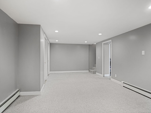 56 Great Neck Rd, Trumbull, CT 06611 - finished basement featuring a baseboard heating unit, recessed lighting, carpet floors, and stairway