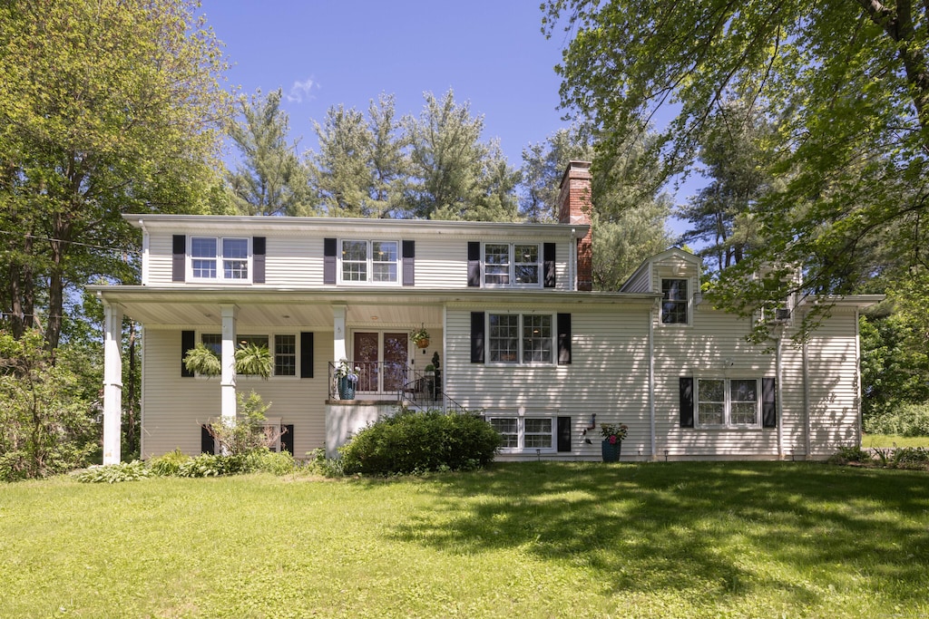 11 Ridge Rd, Newtown, CT 06470 - view of front of house featuring a chimney and a front yard