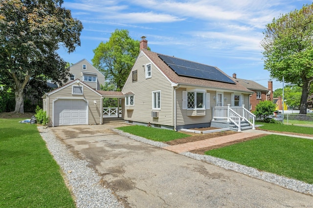 184 Merritt St, Bridgeport, CT 06606 - view of front of home featuring a front yard, a chimney, roof with shingles, solar panels, and asphalt driveway