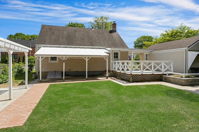 184 Merritt St, Bridgeport, CT 06606 - rear view of property with a wooden deck, a lawn, a chimney, and roof with shingles
