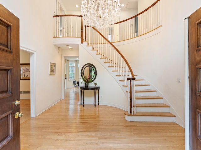 9 Autumn Leaves Rd, Wallingford, CT 06492 - entrance foyer featuring stairs, light wood-style flooring, a chandelier, a towering ceiling, and recessed lighting