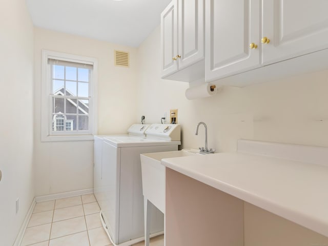 9 Autumn Leaves Rd, Wallingford, CT 06492 - laundry room featuring cabinet space, washer and dryer, and light tile patterned floors