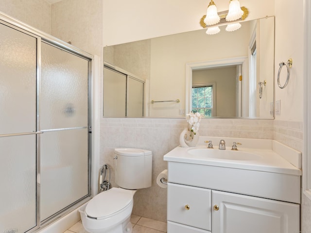 9 Autumn Leaves Rd, Wallingford, CT 06492 - bathroom featuring vanity, a shower stall, tile walls, and tile patterned flooring
