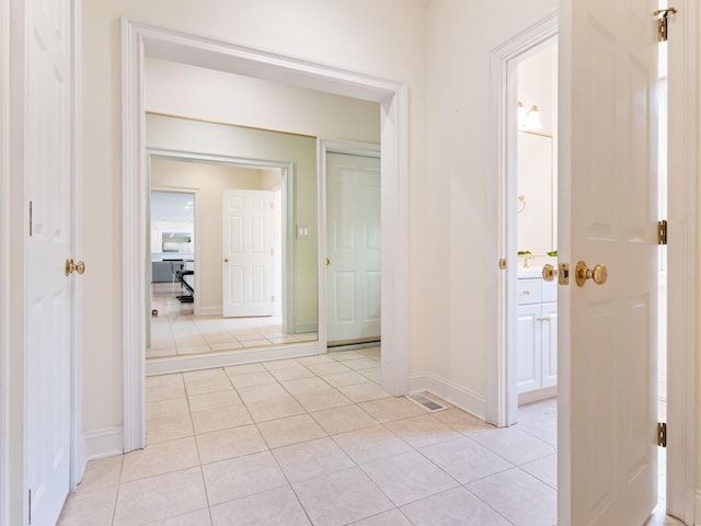 9 Autumn Leaves Rd, Wallingford, CT 06492 - corridor featuring light tile patterned floors and baseboards
