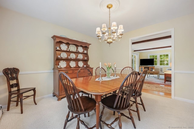 33 Raven Rd, Trumbull, CT 06611 - dining room featuring a chandelier, light colored carpet, and baseboards
