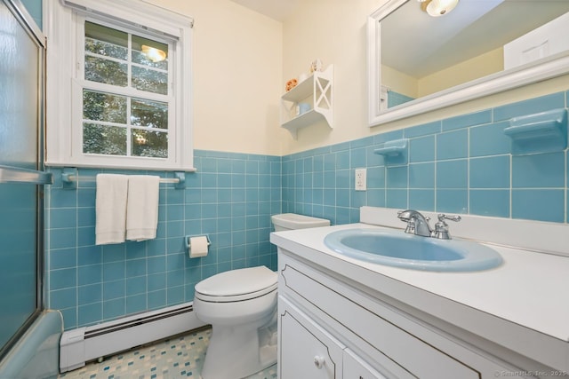 33 Raven Rd, Trumbull, CT 06611 - bathroom with baseboard heating, vanity, toilet, a wainscoted wall, and tile walls