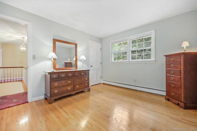 33 Raven Rd, Trumbull, CT 06611 - bedroom featuring a baseboard heating unit, wood-type flooring, and baseboards