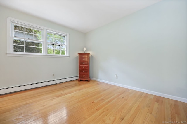 33 Raven Rd, Trumbull, CT 06611 - spare room featuring wood finished floors, a baseboard radiator, and baseboards