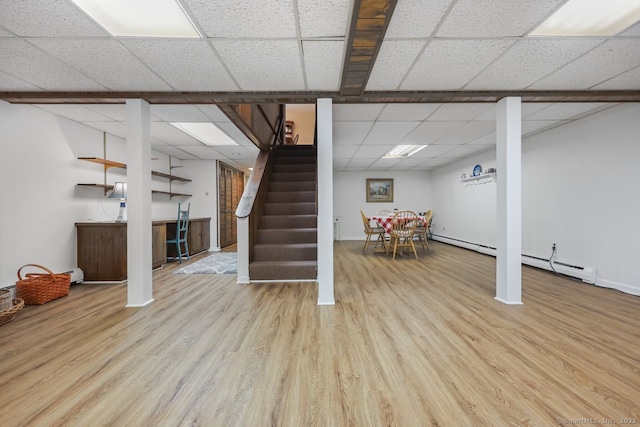 33 Raven Rd, Trumbull, CT 06611 - finished basement featuring stairway, a paneled ceiling, wood finished floors, bar, and baseboards