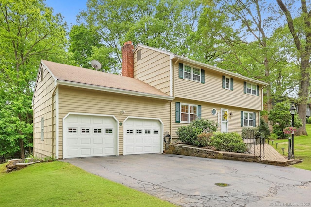 33 Raven Rd, Trumbull, CT 06611 - colonial house with a chimney, an attached garage, driveway, and a front lawn