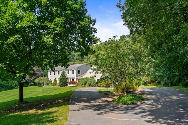 607 Tolland Stage Rd, Tolland, CT 06084 - colonial-style house with driveway and a front yard
