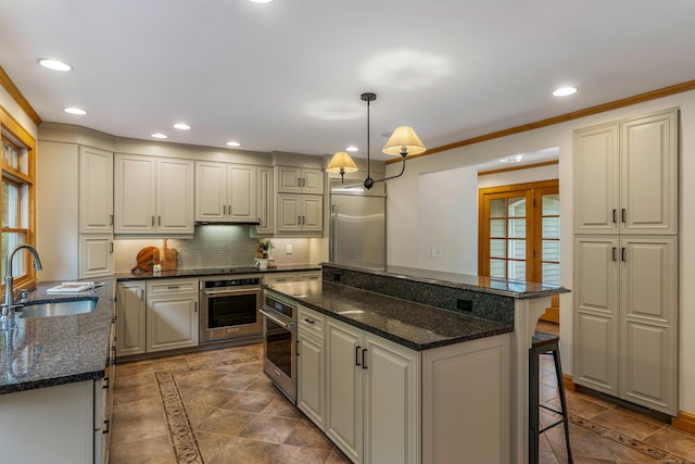 607 Tolland Stage Rd, Tolland, CT 06084 - kitchen featuring a sink, stainless steel appliances, a center island, recessed lighting, and backsplash