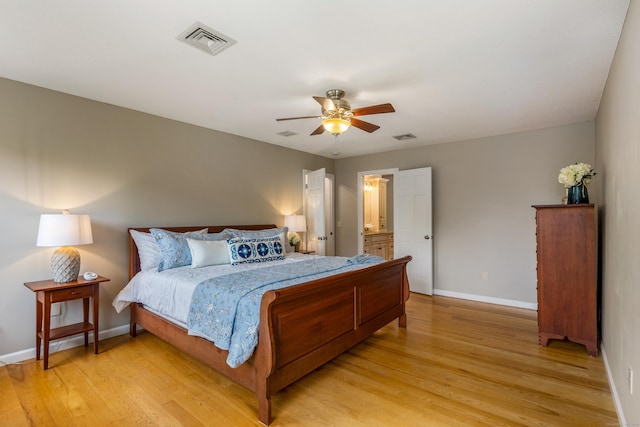607 Tolland Stage Rd, Tolland, CT 06084 - bedroom featuring light wood-style flooring, baseboards, a ceiling fan, and connected bathroom
