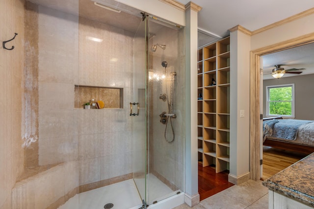 607 Tolland Stage Rd, Tolland, CT 06084 - ensuite bathroom with a stall shower, a ceiling fan, ornamental molding, vanity, and tile patterned flooring