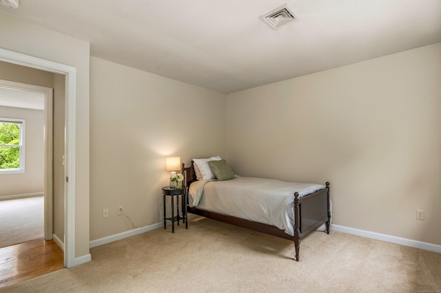 607 Tolland Stage Rd, Tolland, CT 06084 - bedroom with light carpet and baseboards