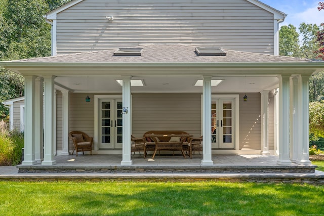 607 Tolland Stage Rd, Tolland, CT 06084 - back of property with french doors and roof with shingles